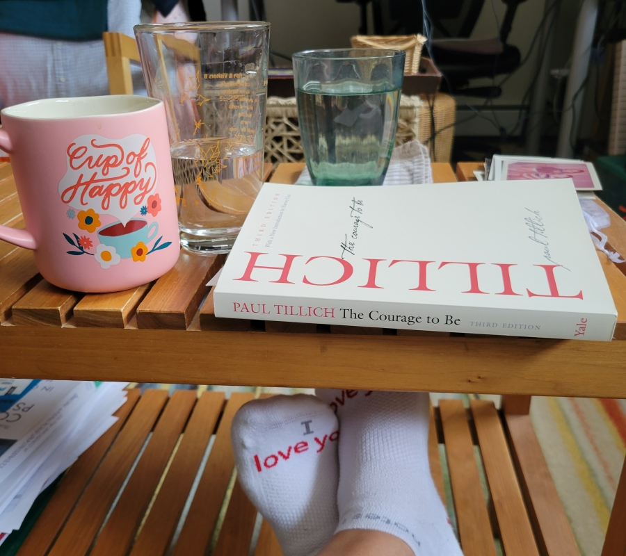picture of feet wearing I love you socks, a coffee cup, and the courage to be by Paul Tillich